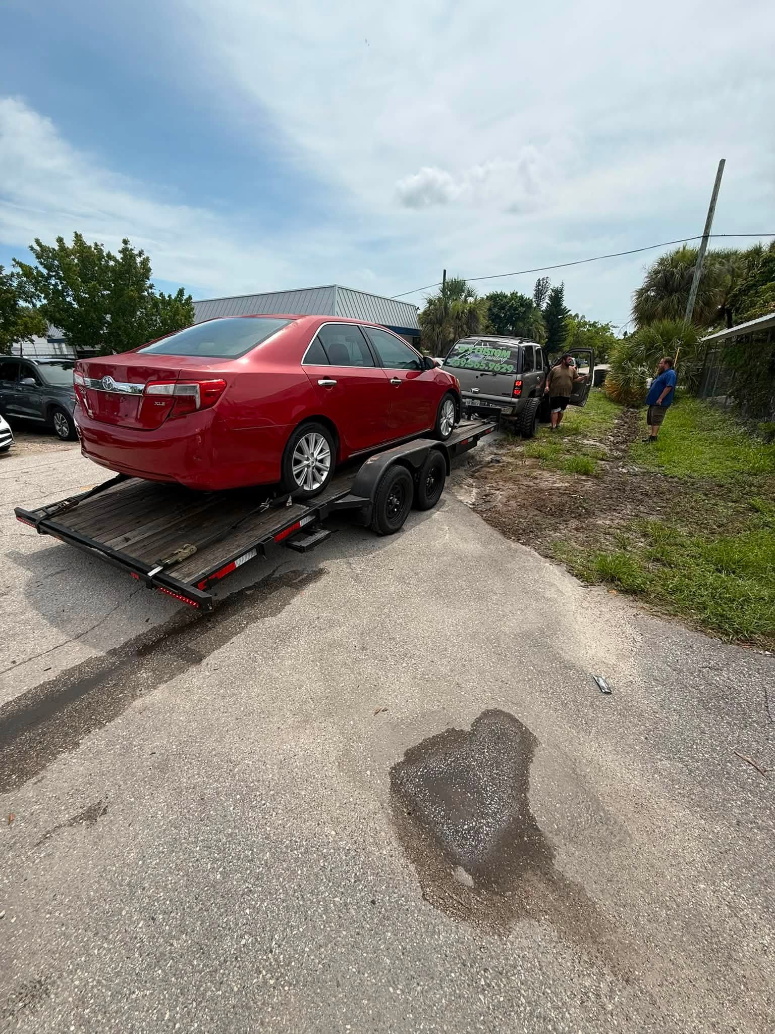Sedan recovered and transported on our professional car hauler.