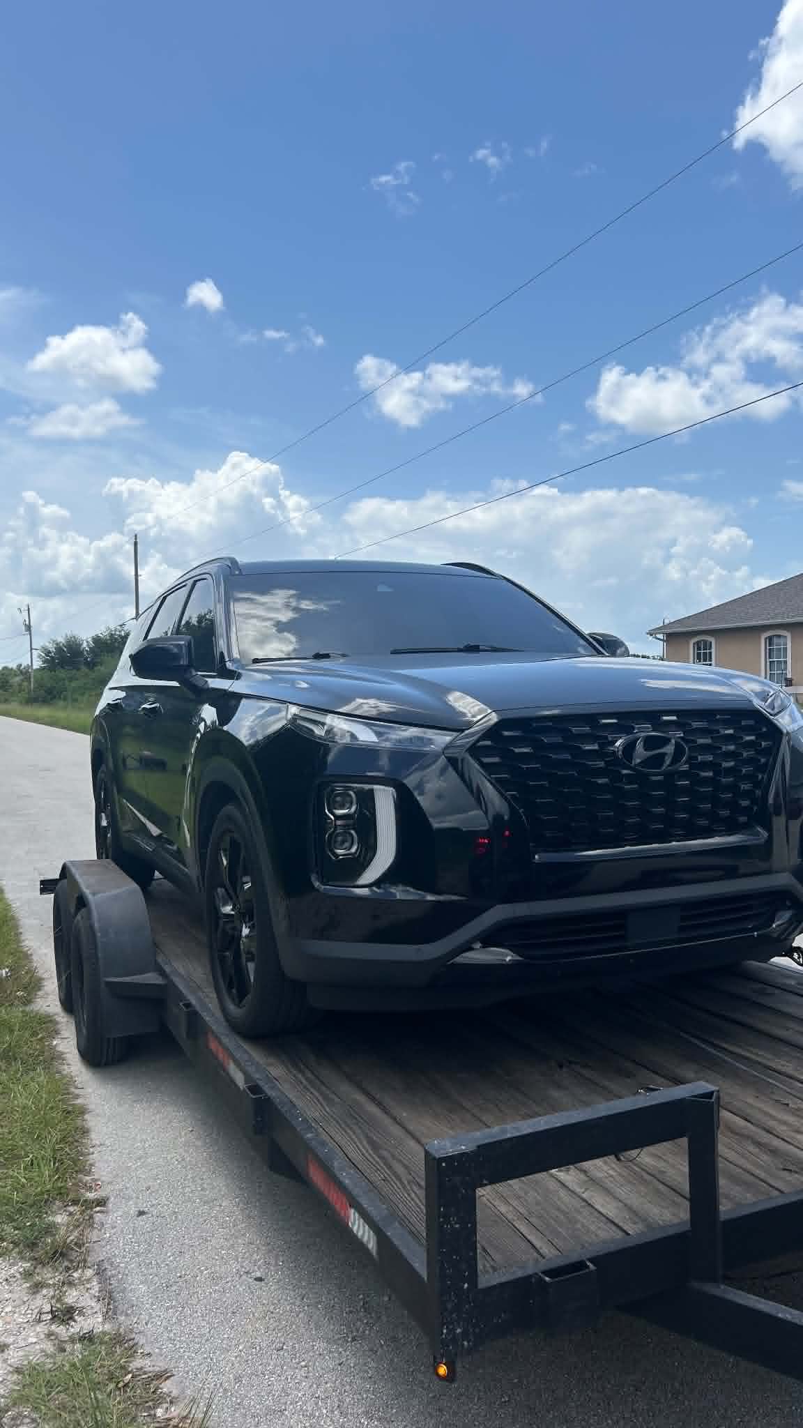 New Hyundai SUV transported damage-free with enclosed wheel straps.